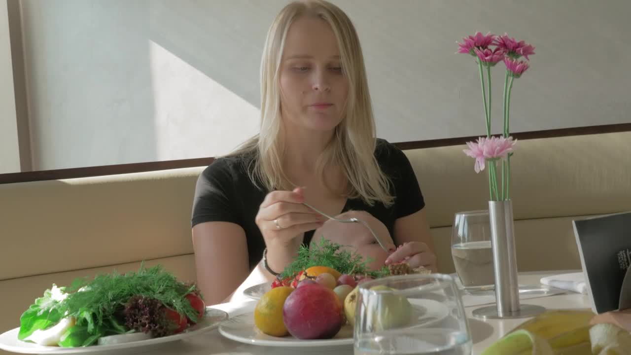 Stock Footage Woman Eating Lunch With Her Baby Live Wallpaper Free