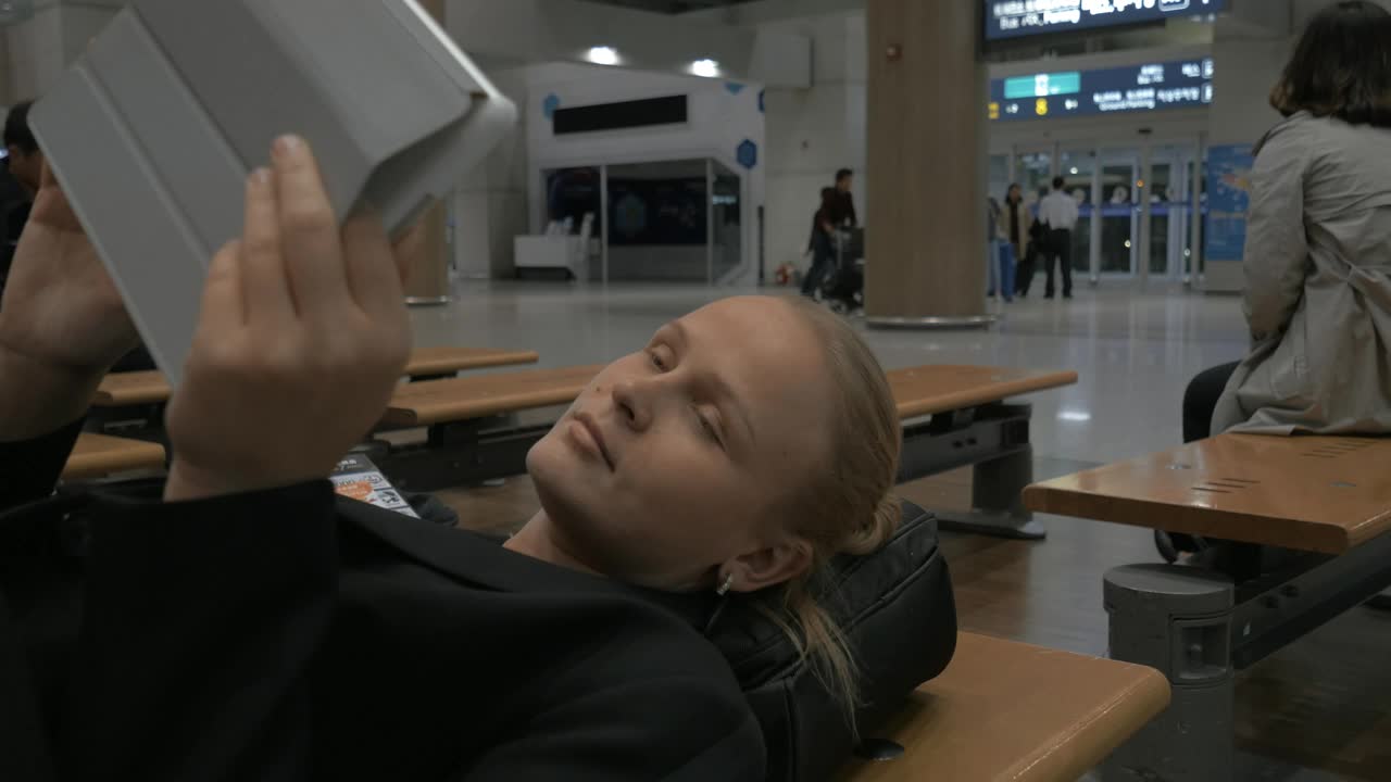 Stock Footage Woman Waiting During A Flight Delay Live Wallpaper Free