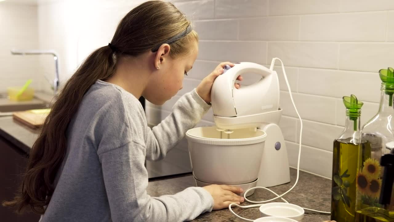 Stock Footage Young Girl Mixing Dough In The Kitchen Live Wallpaper Free