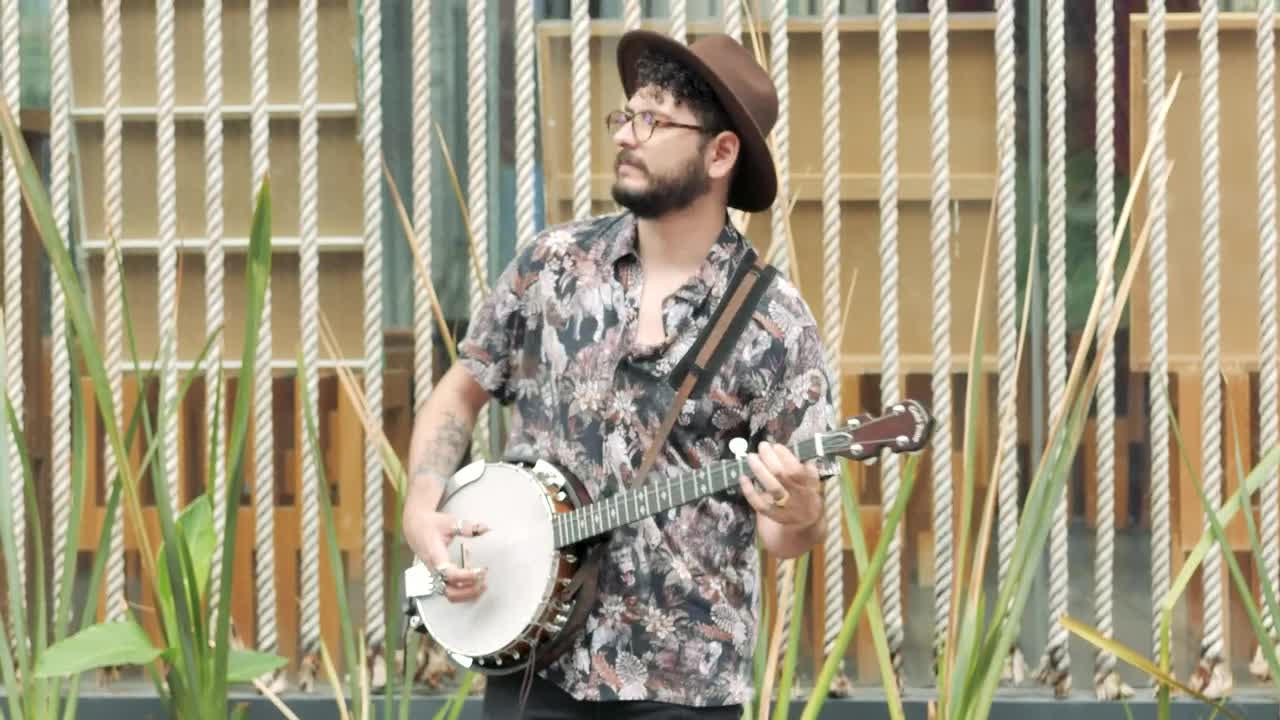 Stock Footage Young Man Playing And Singing With A Banjo In A Live Wallpaper Free