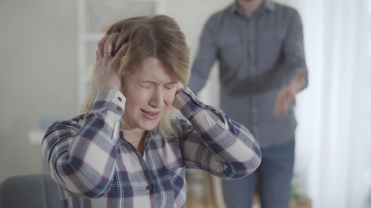 Stock Footage Woman Covers Ears While Man Yells In Background Live Wallpaper Free