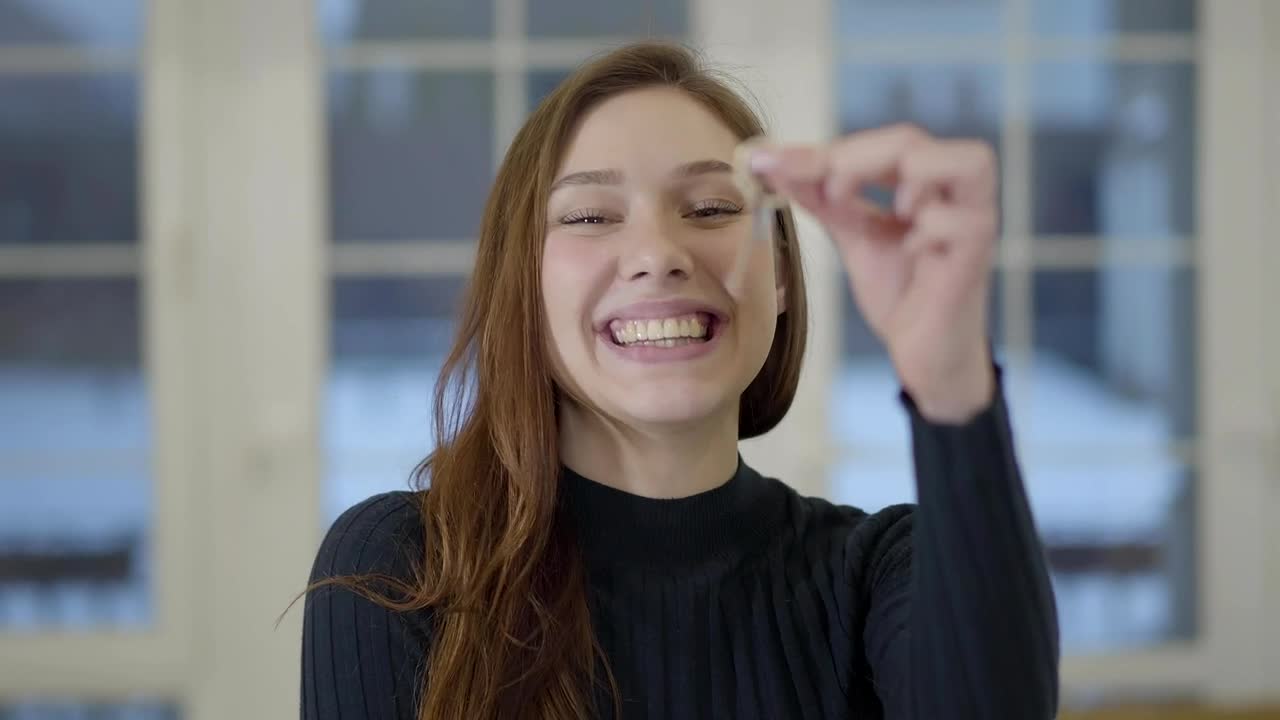 Stock Footage Young Woman Holds Up House Key With Big Smile Live Wallpaper Free