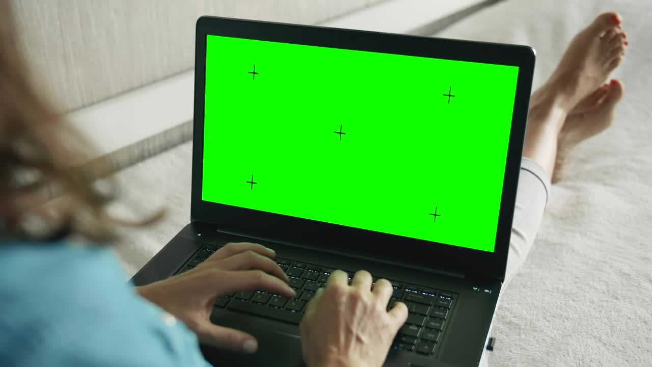 Stock Footage Woman Types On Greenscreen Laptop On Sofa Live Wallpaper Free