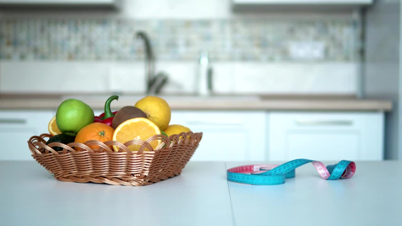 Stock Footage Woman Measures Weight Loss Progress In Kitchen Live Wallpaper Free