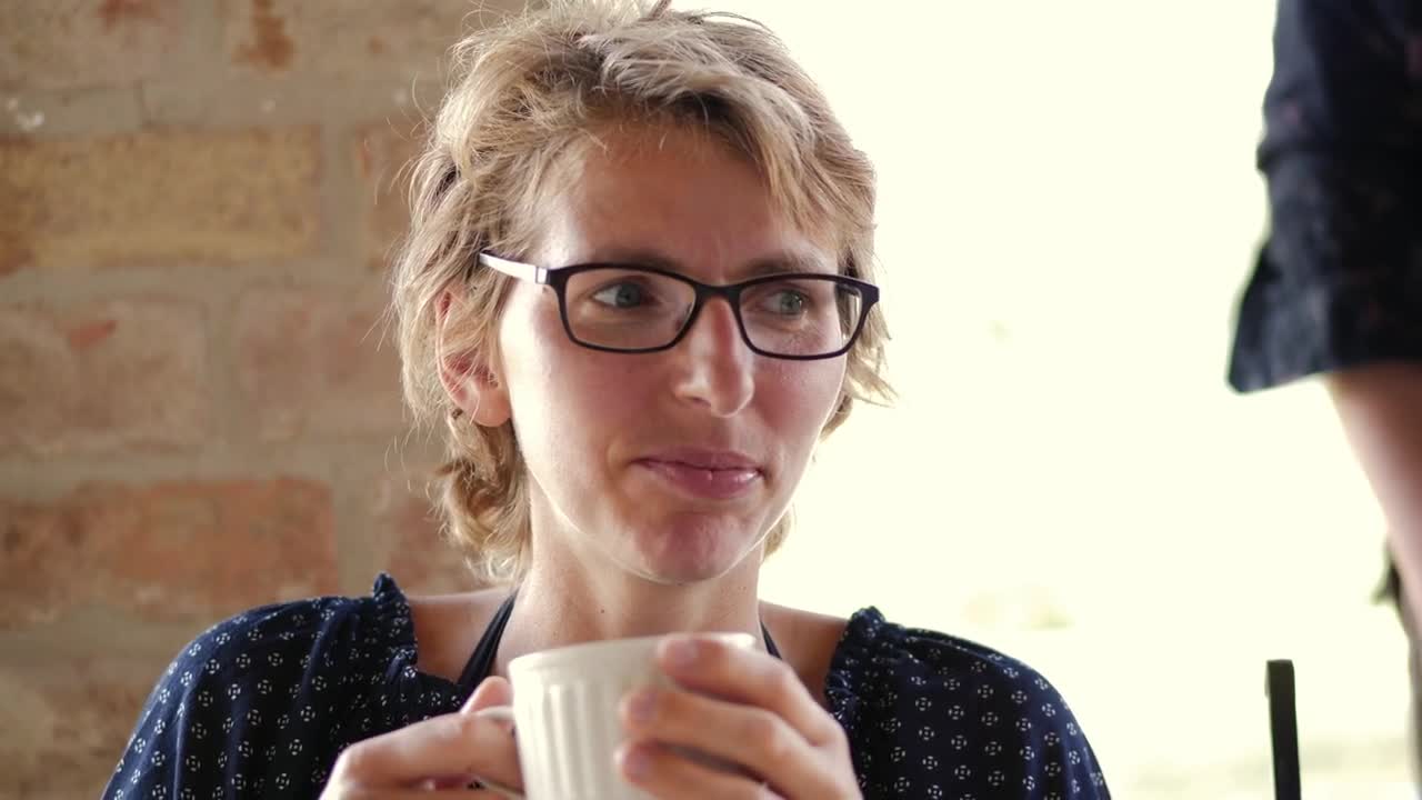 Stock Footage Woman Laughing At A Coffee Shop Live Wallpaper Free