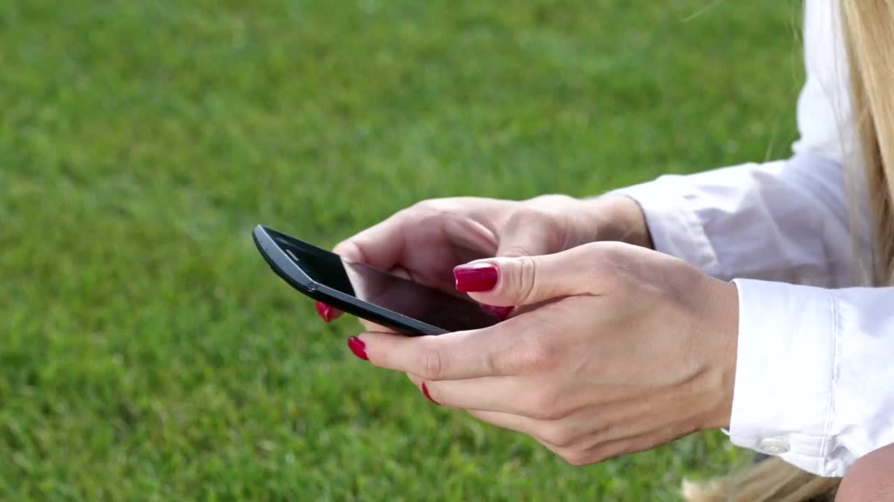 Stock Footage Woman Scrolling Through Her Phone Live Wallpaper Free