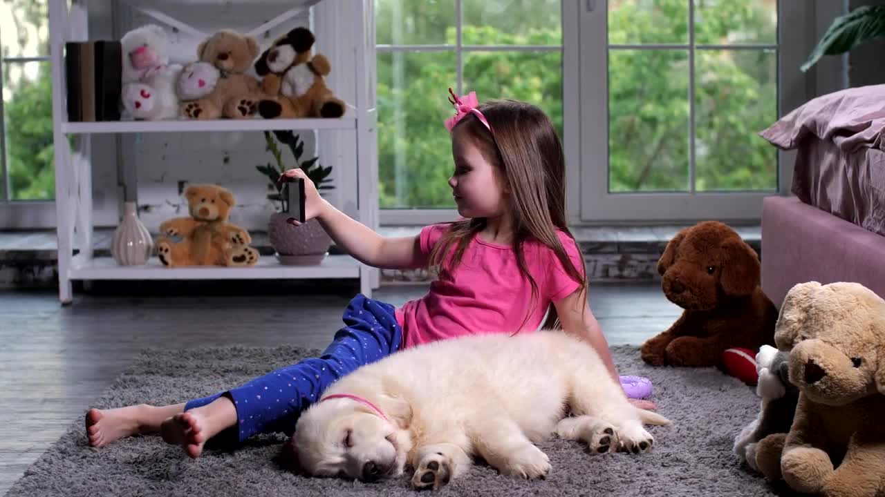 Stock Footage Young Child With A Puppy Taking A Selfie Live Wallpaper Free