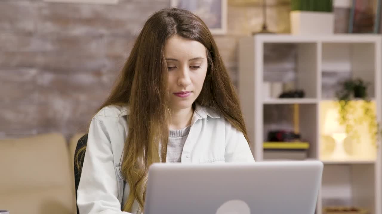 Stock Footage Young Woman Sips Coffee While Working From Home Live Wallpaper Free