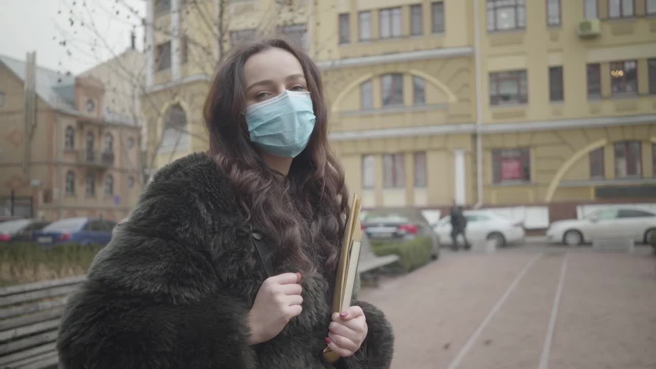 Stock Footage Woman Wearing A Face Mask On The Street Live Wallpaper Free