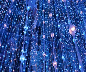 String Of Changing Color Lights Hanging From A Mirror Ceiling Live Wallpaper